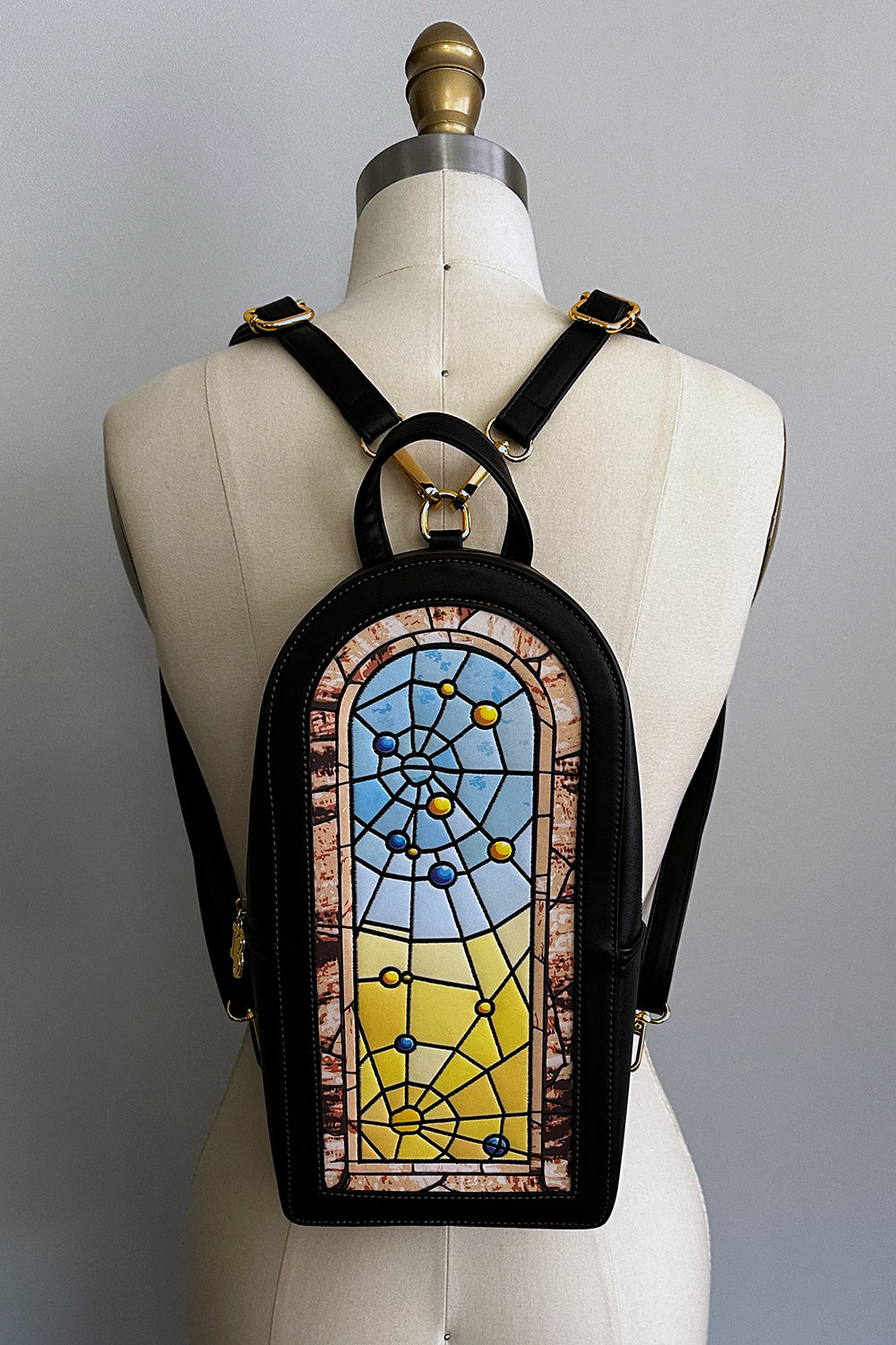 Winchester Mystery House® X TOBS Spiderweb Stained Glass Window Backpack
