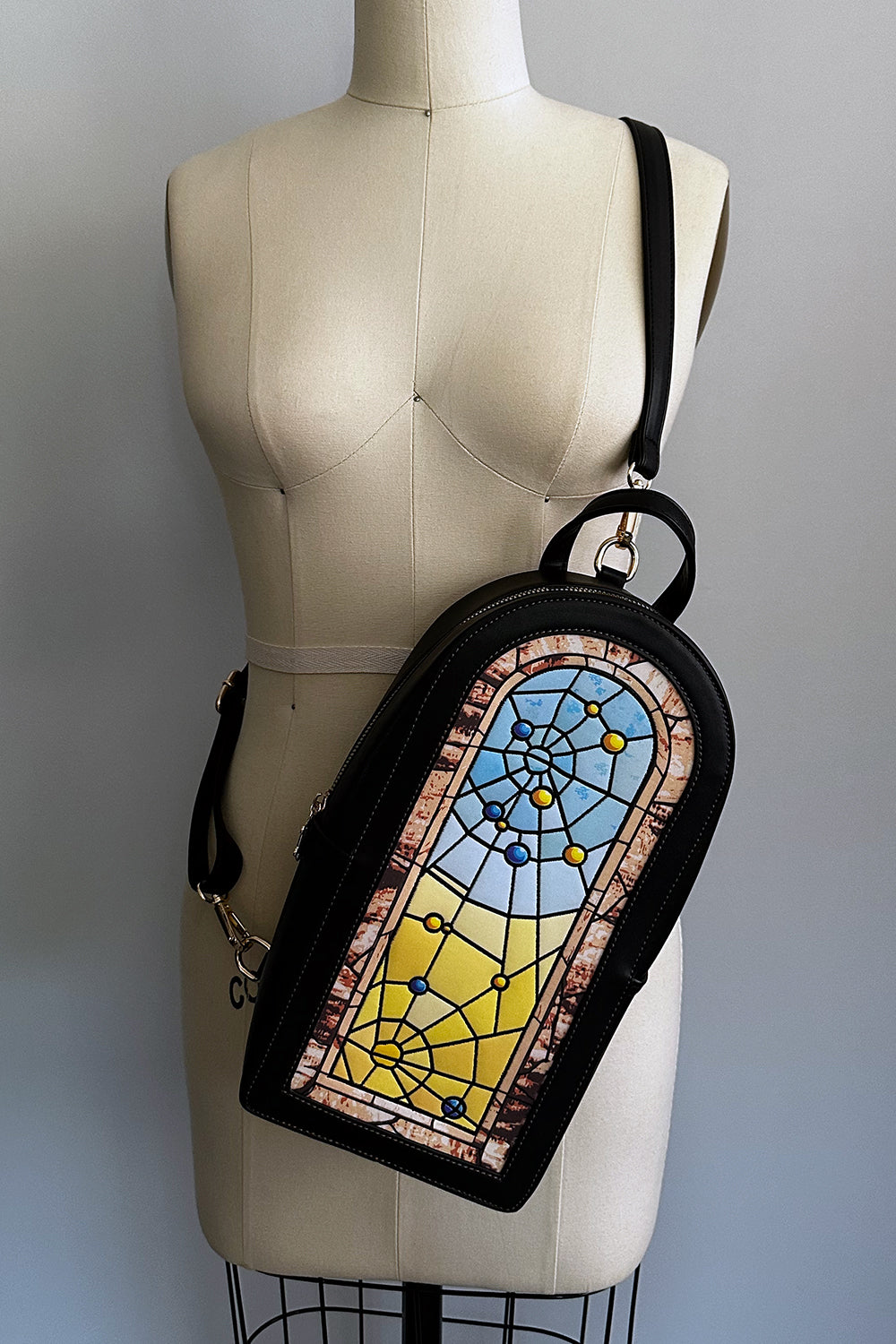 Winchester Mystery House® X TOBS Spiderweb Stained Glass Window Backpack